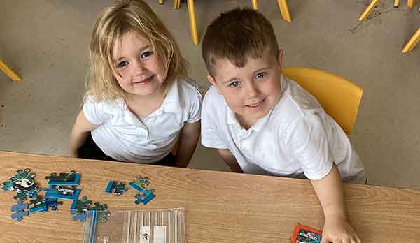 Junior Infants playing with puzzle - Nagle Rice Primary School